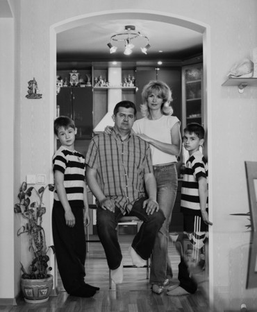Vladimir Mishukov.
Family of construction company financial director.  From a series “The cult of family”. Moscow.
2003-2005. 
Collection of the artist
