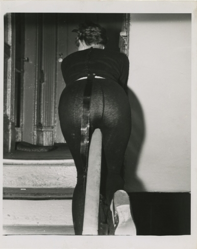 Weegee.
[Woman sliding down banister, Greenwich Village, New York], ca. 1956.
© Weegee/International Center of Photography/Getty Images