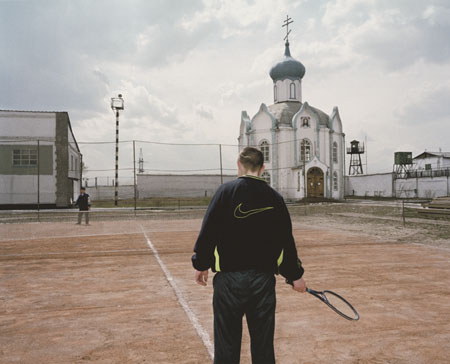 Carl De Keyzer.
Camp 31. Playing tennis for the camera, no balls available. 
2001. 
Project “Zona”. Prison camps. Former Gulags.
Russia. Siberia. Krasnojarsk region. 
© Carl De Keyzer / Magnum Photos