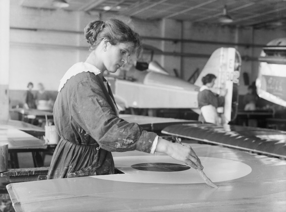 Unknown photographer.
A woman war worker carefully paints the roundel on the wing of an SE5A aircraft at the Austin Motor Company factory in Birmingham. 
September 1918.
Imperial War Museum, London