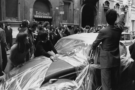 Claudio Abate.
Gastone Novelli and his pupils from the Academia di Belle Arti, rapping a Volkswagen Beetle in front of Feltrinelli bookshop. 
Author's collection, Italy
