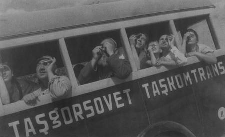 Max Penson.
Solar eclipse being watched passengers through the windows of a bus.Tashkent. 
1934