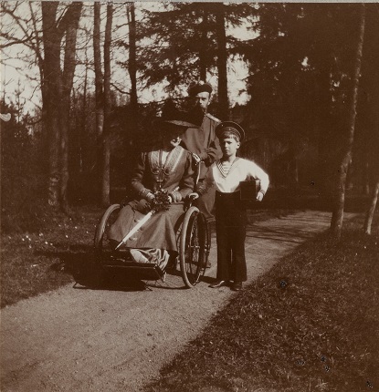 Nicholas II, Alexandra Fedorovna and cesarevitch Alexei on a walk in the park. 1910's.
