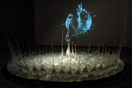 Alexei Kostroma.
View of installation “Speed of Falling”. 
2008. 
Multimedia installation.
(video, sound, natural latex, water)