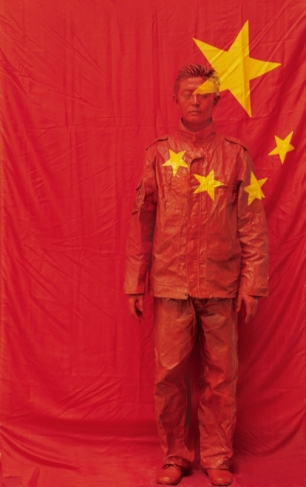 Liu Bolin.
In Front of the Party’s Flag.
From the ‘Hide in the City’ series – 43, 2006.
Digital print.
© Courtesy of Liu Bolin / Galerie Paris-Beijing
