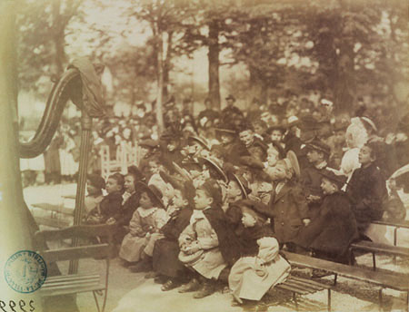 Eugene Atget.
Children at Doll Performance in the Luxembourg Garden, 6th District. 
1898. 
Collection of the City of Paris Historical Library
